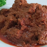 Resep bumbu rendang asli Padang lengkap dengan cara memasak, tips memasak daging empuk, dan rahasia cita rasa rendang Minang autentik.