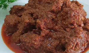 Resep bumbu rendang asli Padang lengkap dengan cara memasak, tips memasak daging empuk, dan rahasia cita rasa rendang Minang autentik.